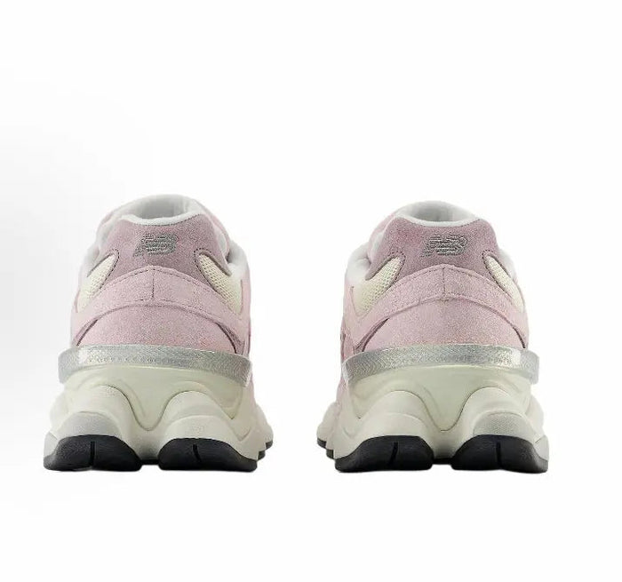 Pink and cream running sneakers rear view with padded collar and black tread sole