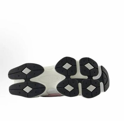 Cream and black sneaker outsoles with multiple traction pods