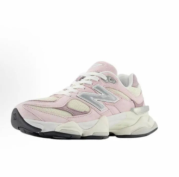 Pink and cream running sneaker side view with lace-up closure and N logo
