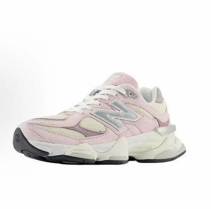 Pink and cream running sneaker side view with lace-up closure and N logo