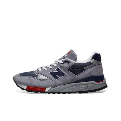 New Balance 998 grey, navy, and red sneakers with lace-up front