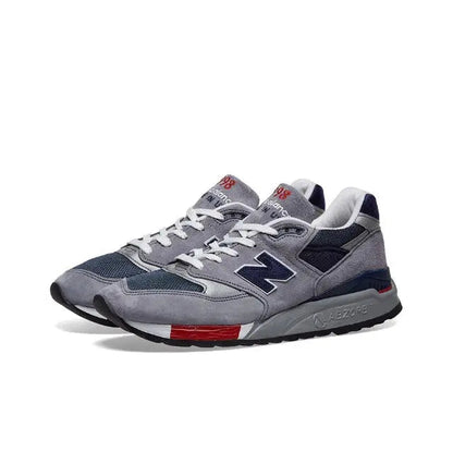 New Balance 998 grey lace-up sneaker with navy side logo and red trim