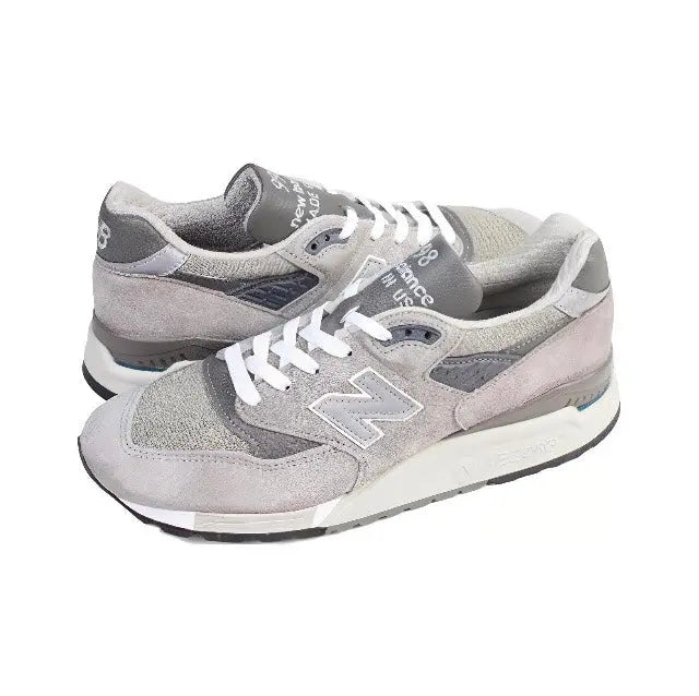 Grey lace-up low-top sneakers with N logo, suede uppers, cushioned sole