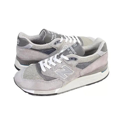 Grey lace-up low-top sneakers with N logo, suede uppers, cushioned sole