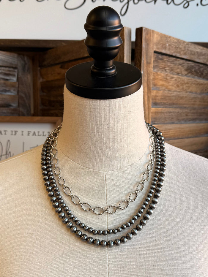 Triple-layer bead and chain necklace with dark beads and silver-tone center chain