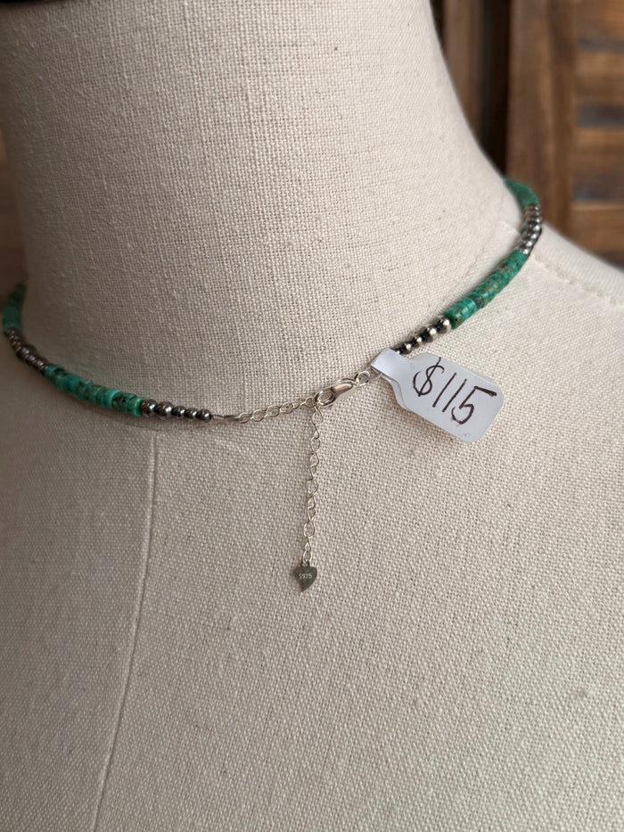 Sterling silver heishi necklace with green beads, 8/15 tag and dangling chain