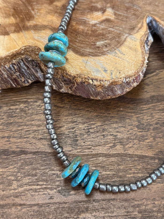Turquoise chunk-bead necklace with silver-tone bead chain and stacked turquoise centerpiece