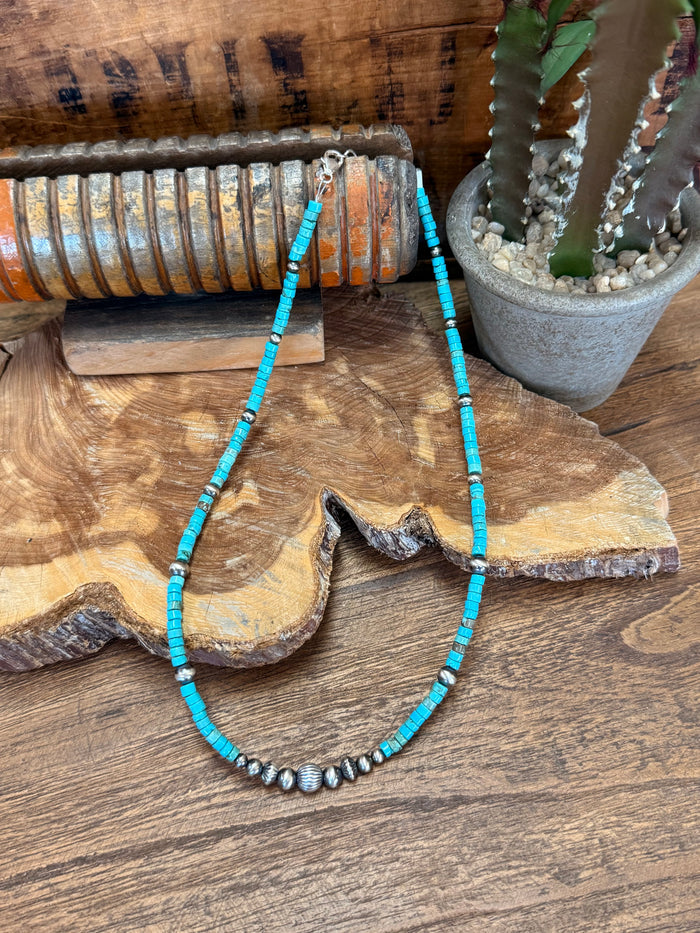 Graduated blue turquoise heishi bead necklace with silver spacer beads