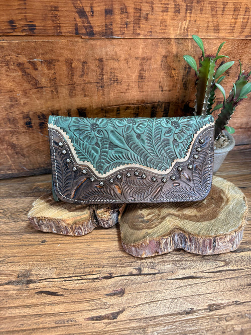 Turquoise leather tooled wallet with brown stitched edge and decorative front panel