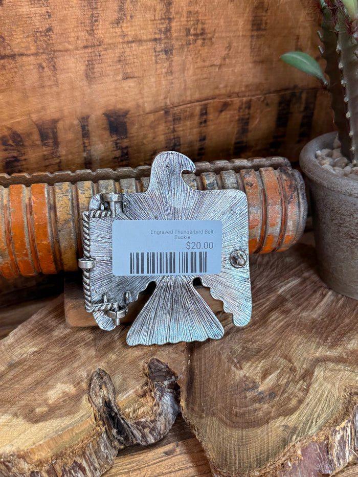 Engraved silver belt buckle back with barcode tag and $20.00 price