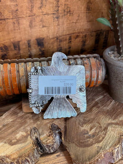 Engraved silver belt buckle back with barcode tag and $20.00 price