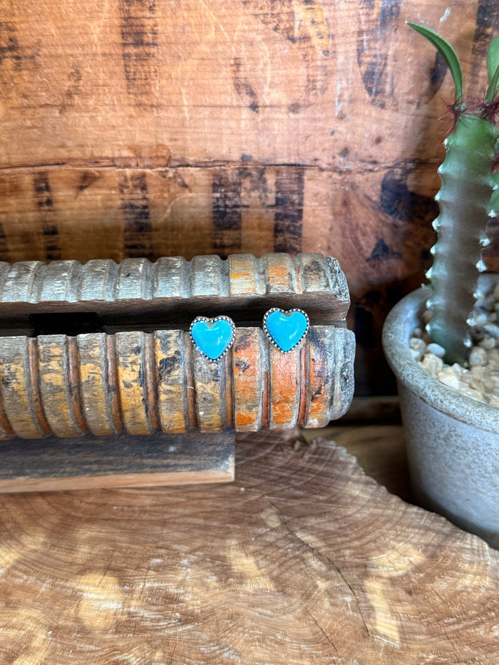 Turquoise heart stud earrings with silver-tone bezels