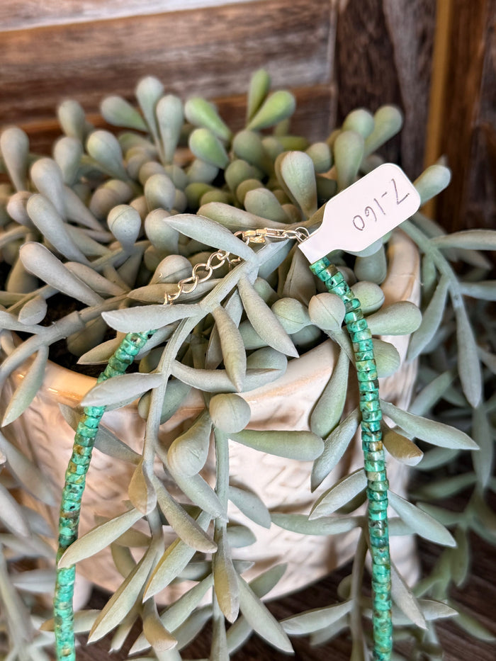 Turquoise green heishi necklace detail, sterling silver accents at top