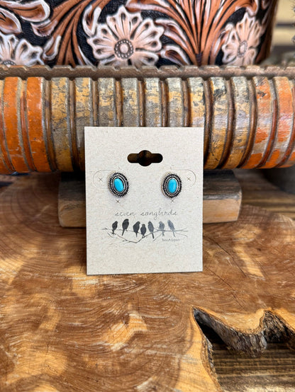 Silver concho stud earrings with round turquoise centers and engraved rope border