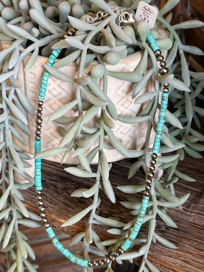 Blue turquoise heishi bead necklace with gold-tone beads and toggle clasp