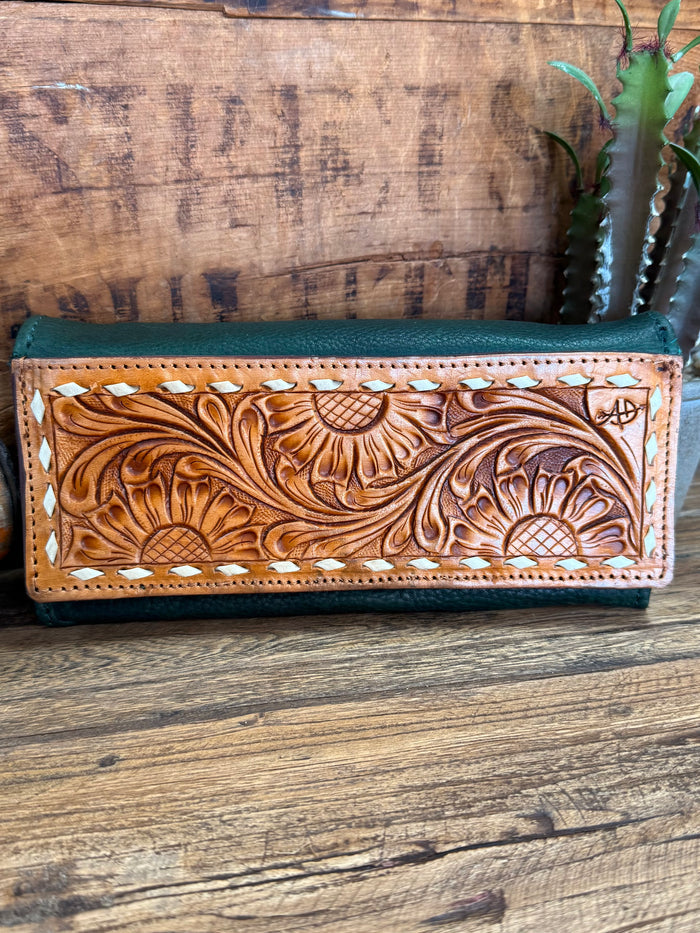 Green leather wallet with brown carved floral panel, perforated edge trim, snap closure