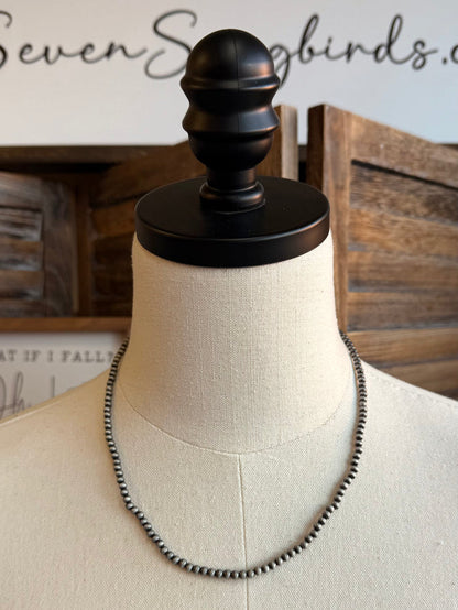 18in 4mm silver pearl necklace draped on mannequin bust, round clasp