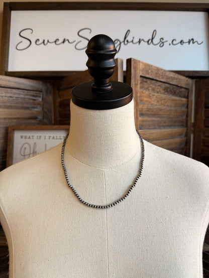 18in 4mm silver pearl necklace on mannequin, loop clasp