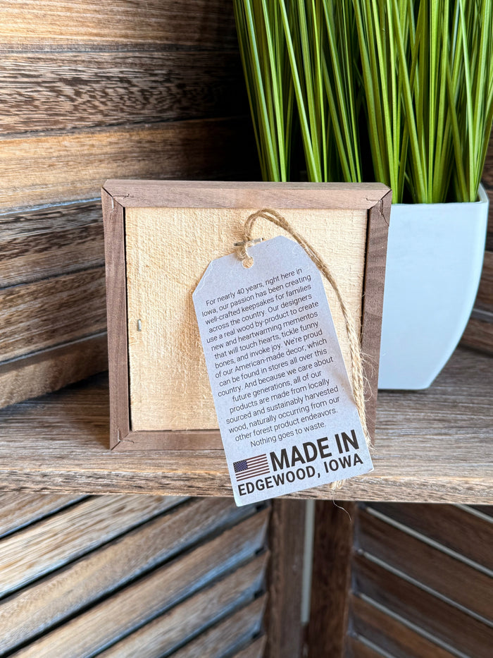 4x4 framed artwork back with text card and 'Made in Edgewood, Iowa' label
