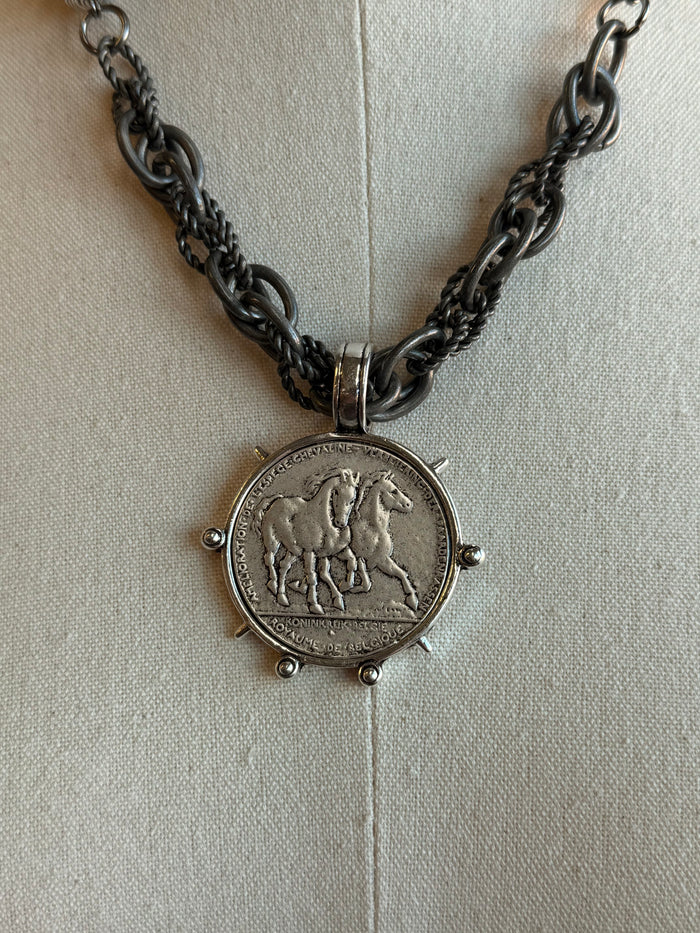 Round horse coin pendant with silver-tone engraving on chunky chain