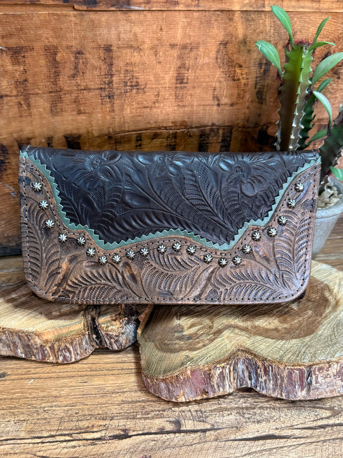Dark blue leather wallet with detailed embossed floral tooling and silver-toned studs