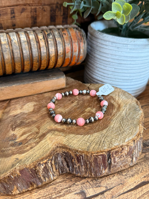Stretchy pink beaded bracelet with silver-tone pearl accents