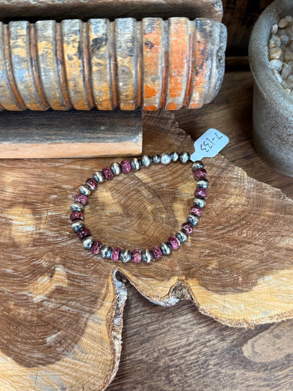 Stretchy beaded bracelet with purple spiny oyster beads and silver-toned pearl accents