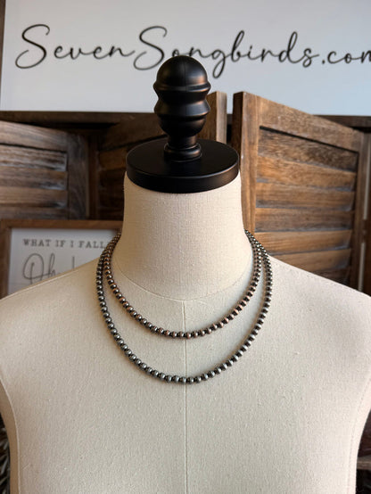 18-inch 6mm silver-tone beaded necklace on a mannequin, double-strand style