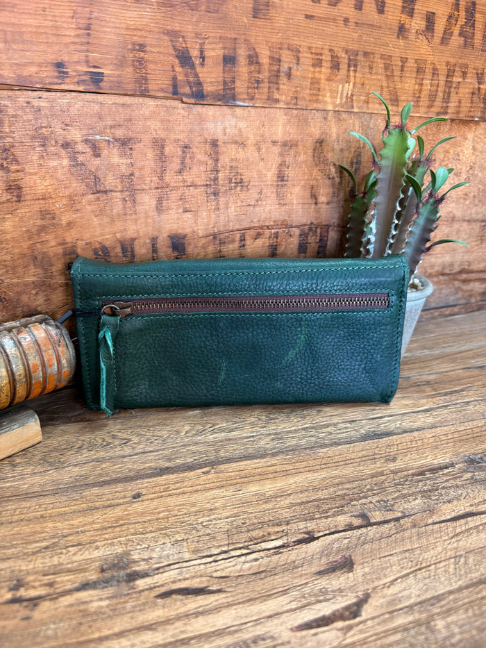 Green leather zip wallet with teal exterior and zipper pocket front