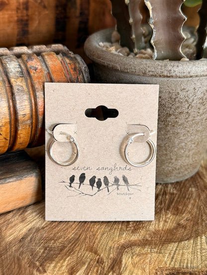 Silpada sterling silver round hoop earrings with circular loops on gift card