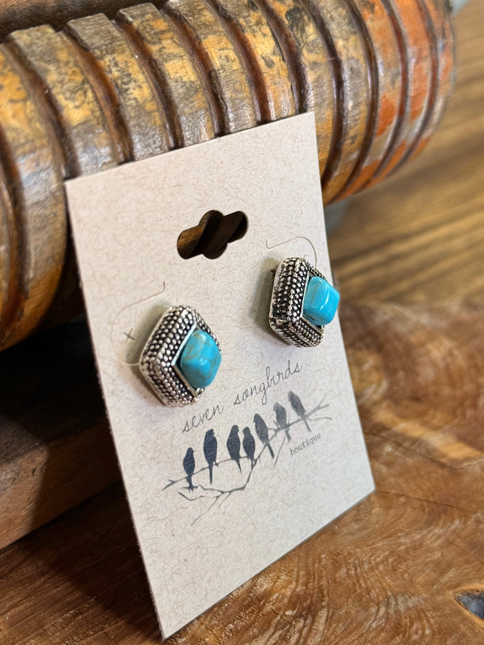 Turquoise square stud earrings with silver-tone rope bezel, side view