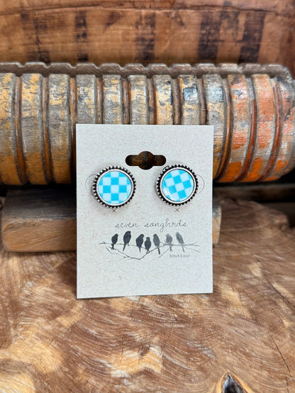 Blue-and-white checkered circular stud earrings with metal bead edging