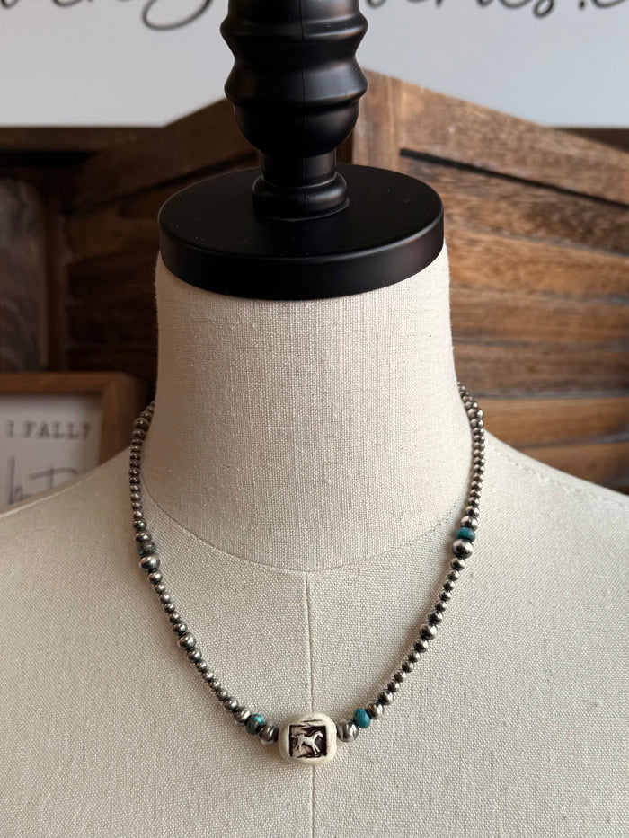 Sterling silver bead necklace with square center charm and turquoise accent beads