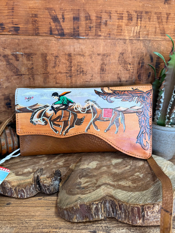 Hand-painted leather crossbody wallet with desert cowboy horse scene and leather strap