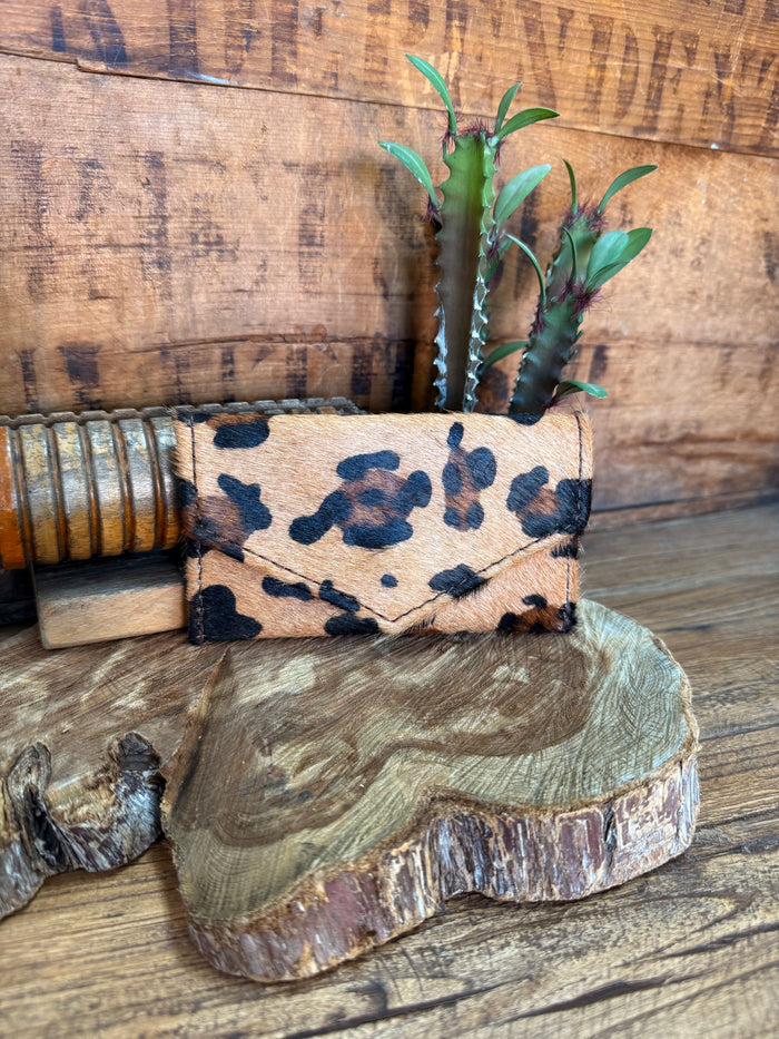 Hair-on envelope coin card wallet with leopard-style hide print.