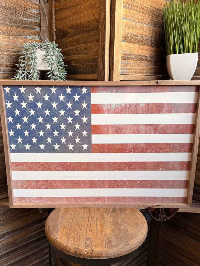 Framed American flag wall art in wood frame with blue star section and stripes
