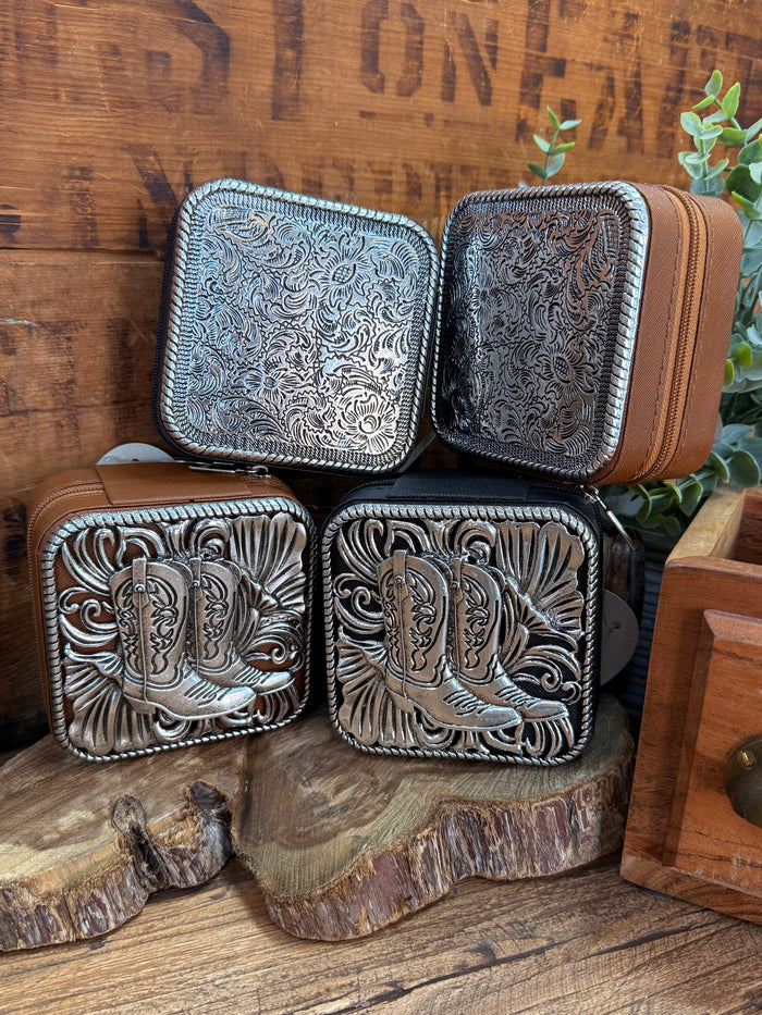 Small engraved metal travel jewelry box set with light and dark silver lids open