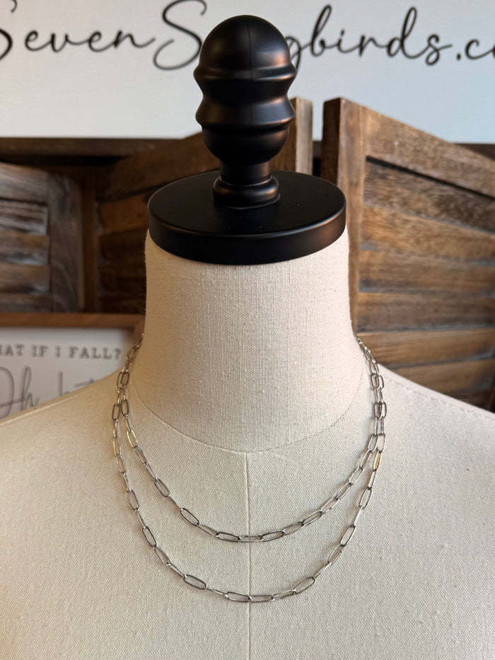 Silver double-layer chain necklace with layered links on bust