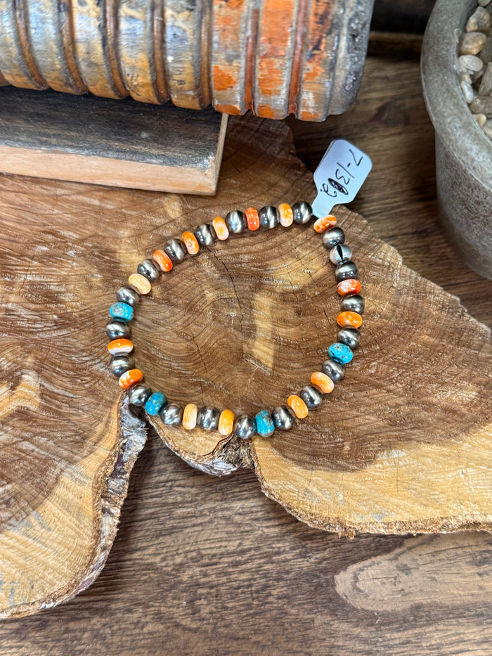 Stretch beaded bracelet with turquoise and orange spiny shell beads and white pearls