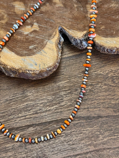 Orange spiny oyster chip necklace with sterling silver beads and small multicolor stones