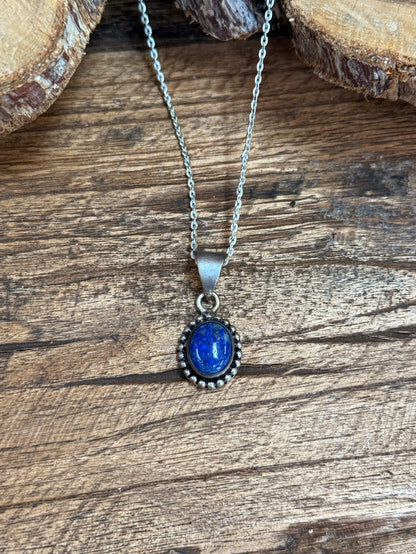 Oval lapis blue pendant on delicate silver chain