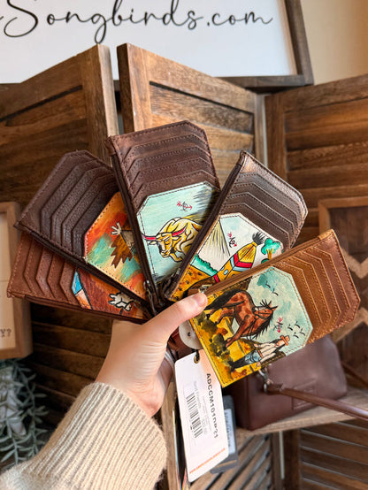 Hand-painted card and coin wallet set, shown in hand, featuring colorful wildlife and rider artwork