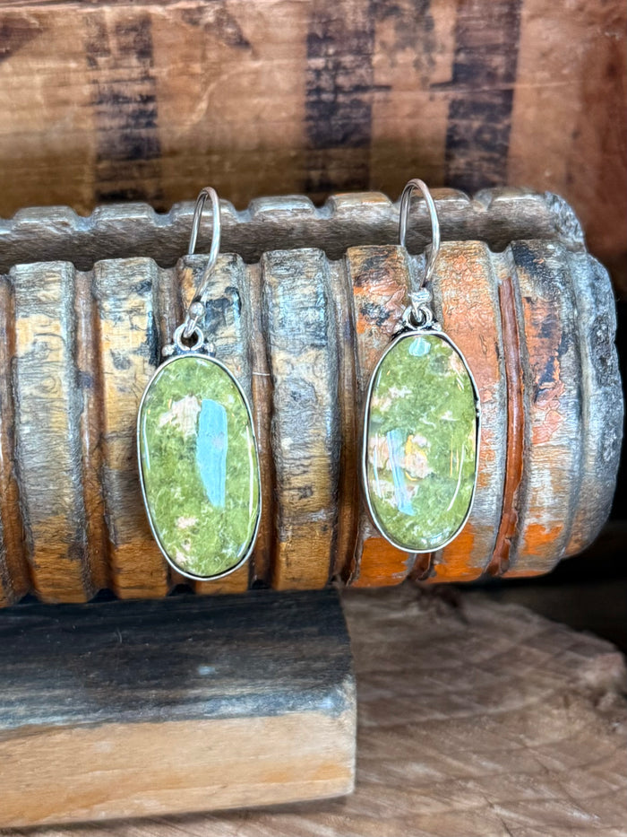Silver-plated fishhook earrings with green oval natural stone cabochons and hanging loops