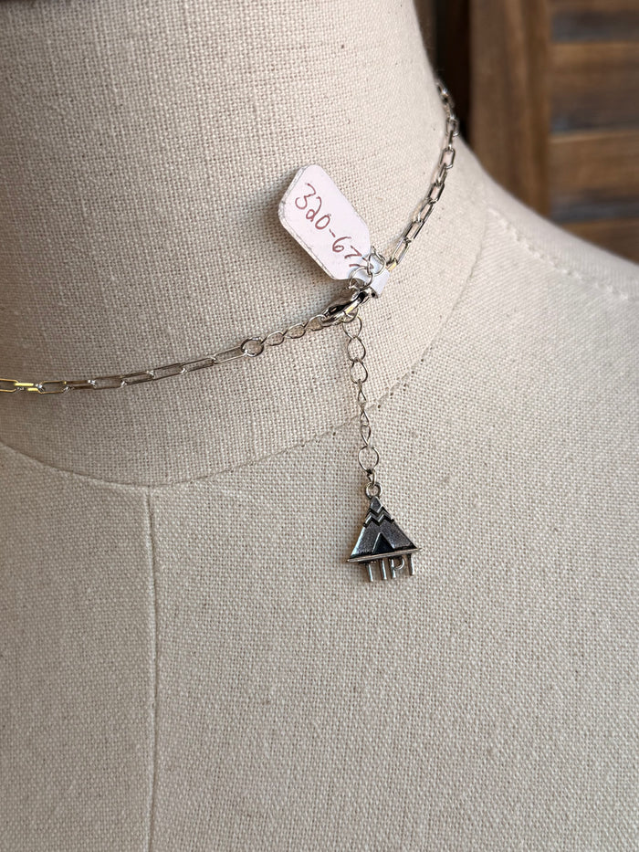 Silver-tone necklace with small boot pendant on a linked chain