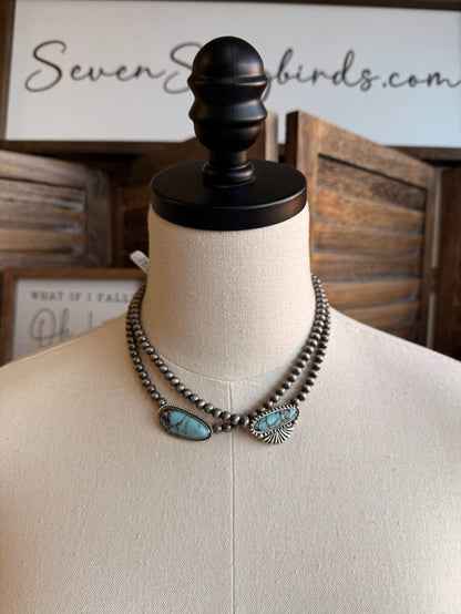 Turquoise chunk necklace with silver-tone bead chain and two fan-shaped turquoise pendants