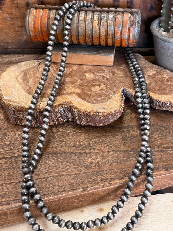 Endless pearl bead necklace with dark gray beads, long double strand drape