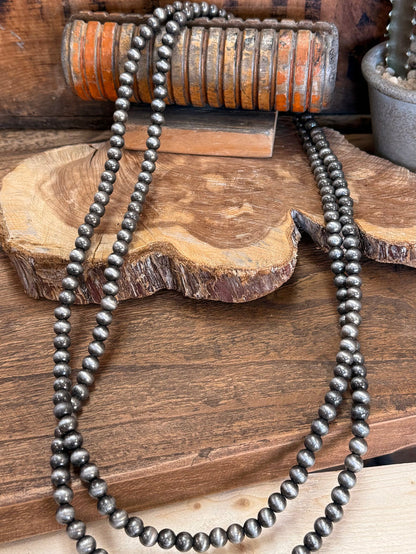 Endless pearl bead necklace with dark gray beads, long double strand drape