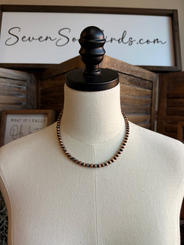 16-inch genuine copper bead necklace with small round copper-tone beads on display