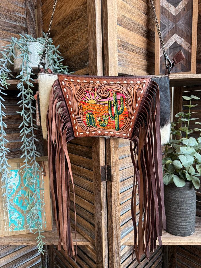 Tooled cowhide fringe purse with cactus-sunset front panel and chain strap