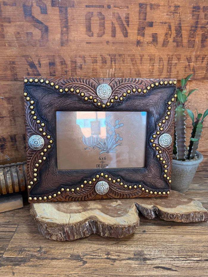 Faux leather 4x6 frame with ornate concho trim and blue floral center art
